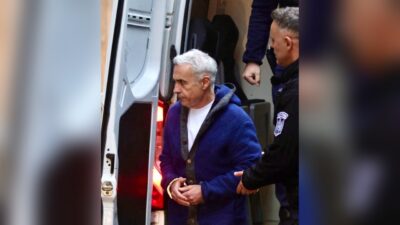 Călin Georgescu, escortat de polițiști
